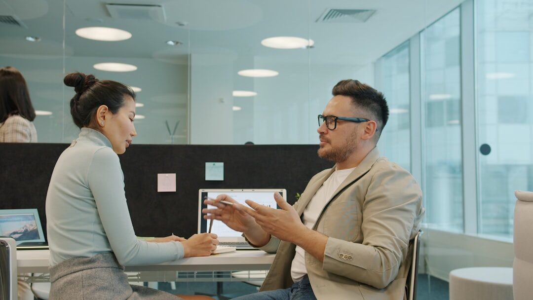 Roundtable business discussion in modern office conference room